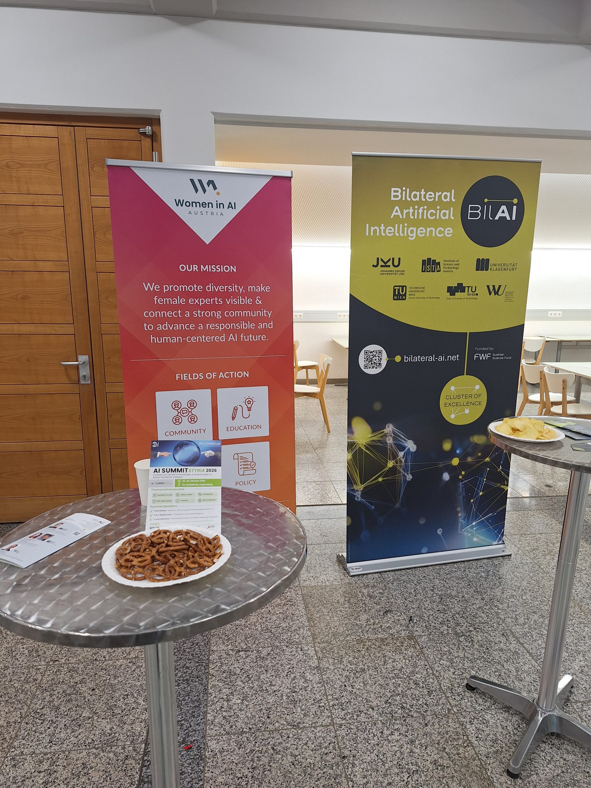 2 Rollups in the networking area at the event Women in AI.